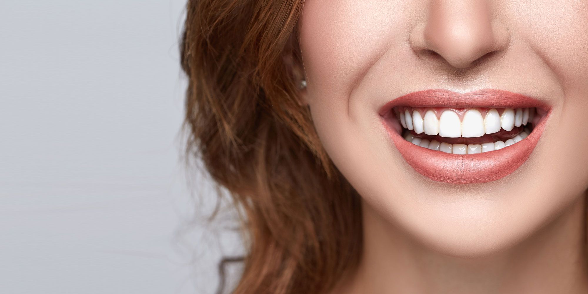 dental patient smiling after teeth whitening procedure Waterford, CT