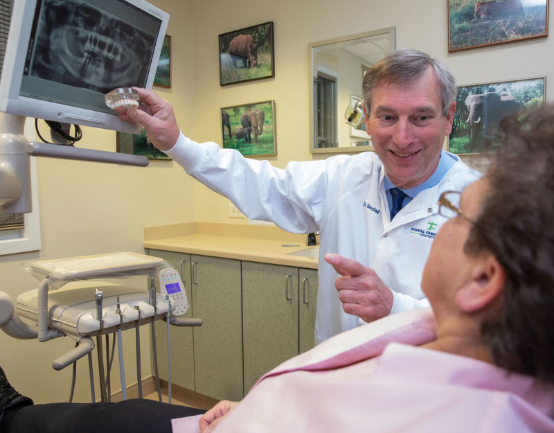 dentist discussing dental implants procedure Waterford, CT